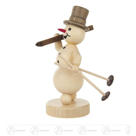 Schneemann mit Ski auf Schulter