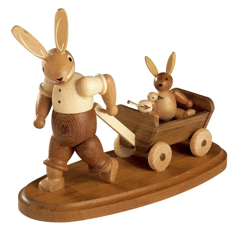 Hasenvater mit Kind auf Bollerwagen