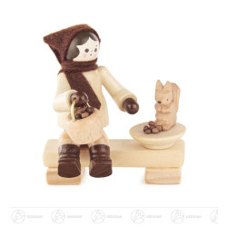 Mädchen auf Bank füttert...