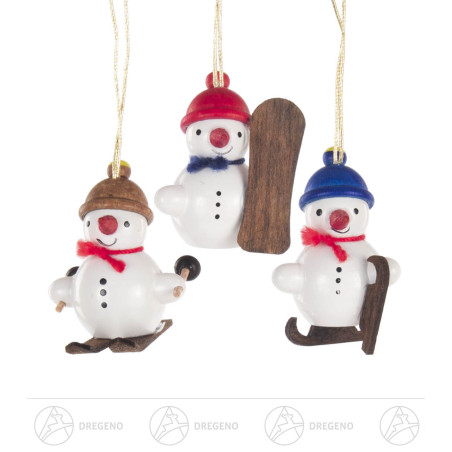 Behang Schneemanntrio Wintersportler